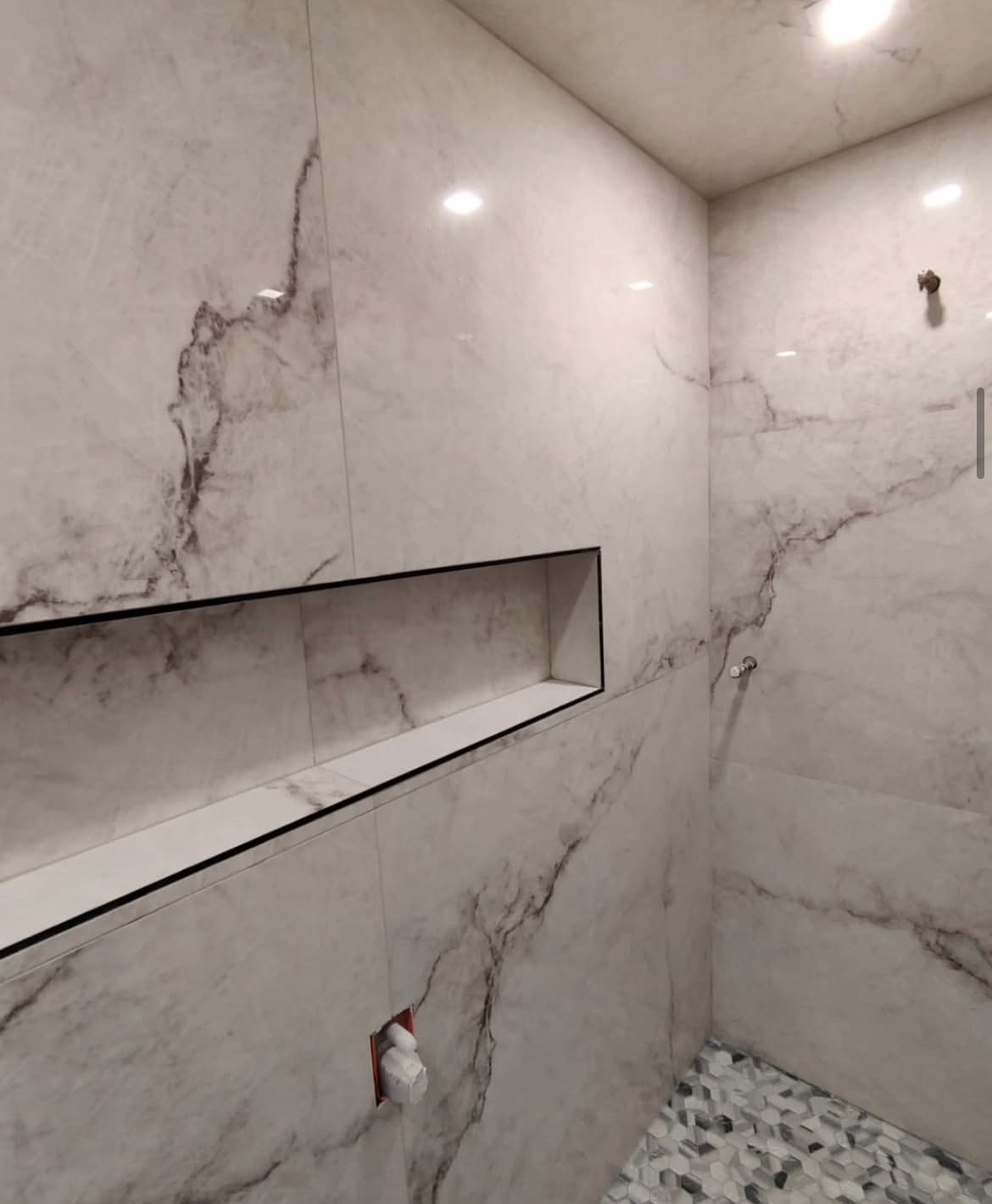 Bookmatched marble installation by Dynamic Tile & Stone